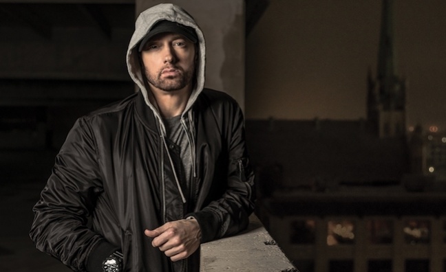 Eminem retakes lead in albums battle
