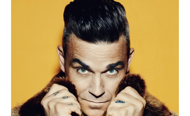 Robbie Williams receives BRIT Icon award from Take That at Troxy concert